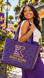 Woman carrying Edna Karr High School purple spirit tote in New Orleans