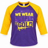 Purple and gold youth raglan shirt with On Gameday We Wear Purple & Gold design